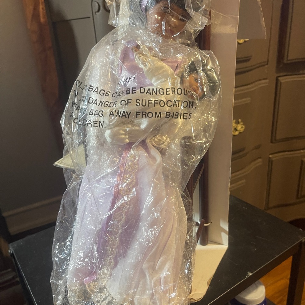 Mother and child Doll sitting in chair